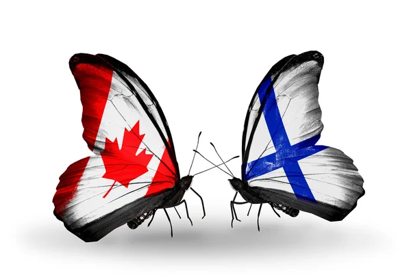 İki kanat bayrakları ile ilişkileri sembolü olarak Kanada ve Finlandiya kelebekler — Stok fotoğraf
