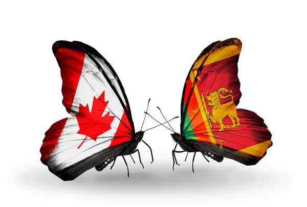 Zwei schmetterlinge mit fahnen auf flügeln als symbol der beziehungen canada und sri lanka — Stockfoto