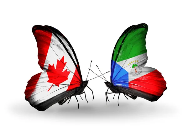 Deux papillons avec des drapeaux sur les ailes comme symbole des relations Canada-Guinée équatoriale — Photo