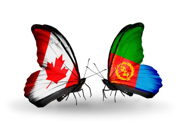 Due farfalle con bandiere sulle ali come simbolo delle relazioni Canada ed Eritrea — Foto Stock