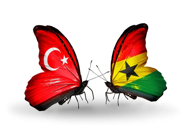 Zwei Schmetterlinge mit Flaggen auf Flügeln als Symbol der Beziehungen Türkei und Ghana — Stockfoto