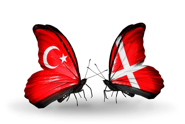 Two butterflies with flags on wings as symbol of relations Turkey and Denmark — Stock Photo, Image