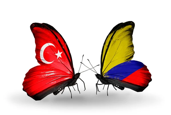 Dos mariposas con banderas en alas como símbolo de relaciones Turquía y Colombia —  Fotos de Stock