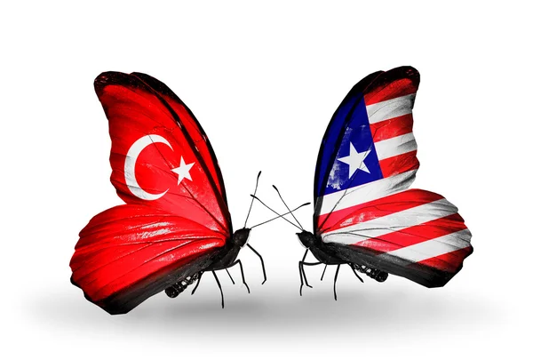 Two butterflies with flags on wings as symbol of relations Turkey and Liberia — Stock Photo, Image