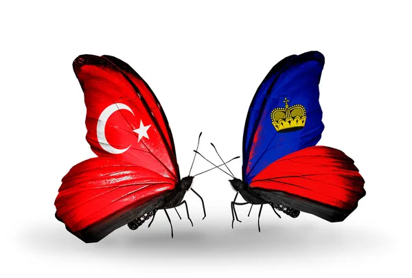 Две бабочки с флагами на крыльях как символ отношений Турции и Лихтенштейна — стоковое фото