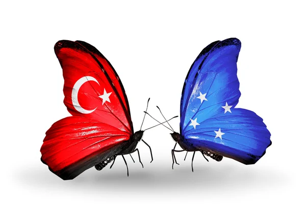 Two butterflies with flags on wings as symbol of relations Turkey and Micronesia — Stock Photo, Image