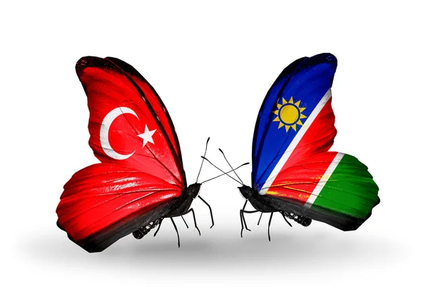 Two butterflies with flags on wings as symbol of relations Turkey and Namibia — Stock Photo, Image