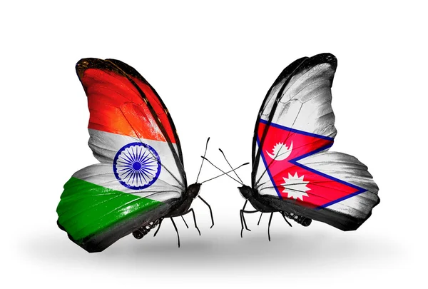 Dva motýli s příznaky na křídlech jako symbol vztahů, Indie a Nepál — Stock fotografie
