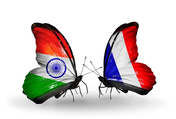 Dos mariposas con banderas en alas como símbolo de relaciones India y Francia —  Fotos de Stock