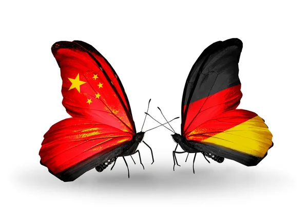 Two butterflies with flags on wings as symbol of relations China and Germany — Stock Photo, Image