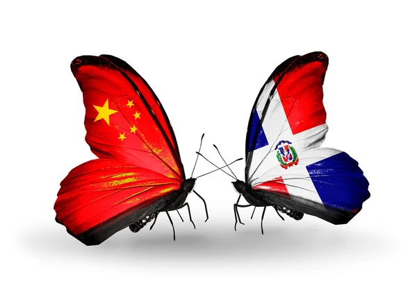 Two butterflies with flags on wings as symbol of relations China and Dominicana — Stock Photo, Image