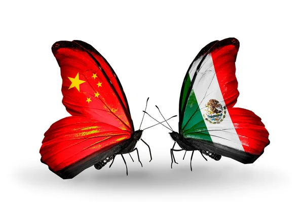 Two butterflies with flags on wings as symbol of relations China and Mexico — Stock Photo, Image