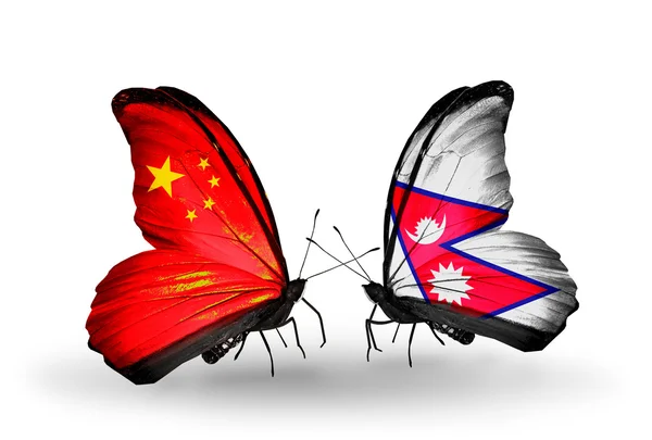 Two butterflies with flags on wings as symbol of relations China and Nepal — Stock Photo, Image