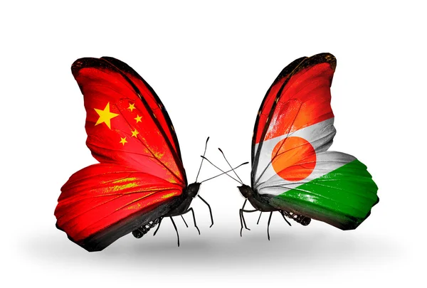 Two butterflies with flags on wings as symbol of relations China and Niger — Stock Photo, Image