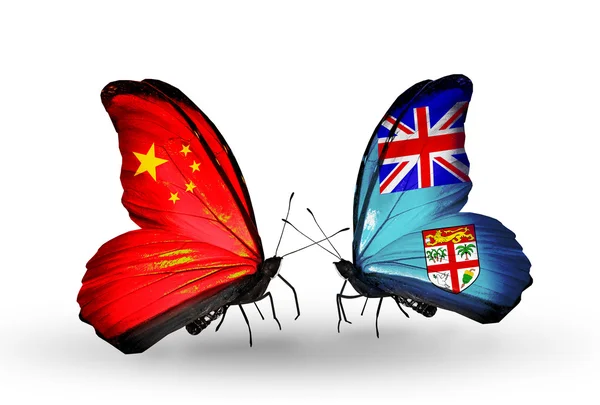 Duas borboletas com bandeiras em asas como símbolo de relações China e Fiji — Fotografia de Stock
