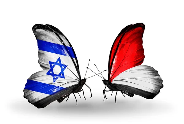 Deux papillons avec des drapeaux sur les ailes comme symbole des relations Israël et Monaco, Indonésie — Photo