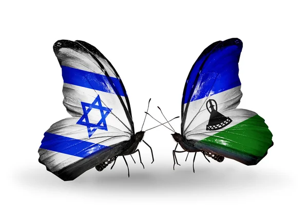 Two butterflies with flags on wings as symbol of relations Israel and Lesotho — Stock Photo, Image