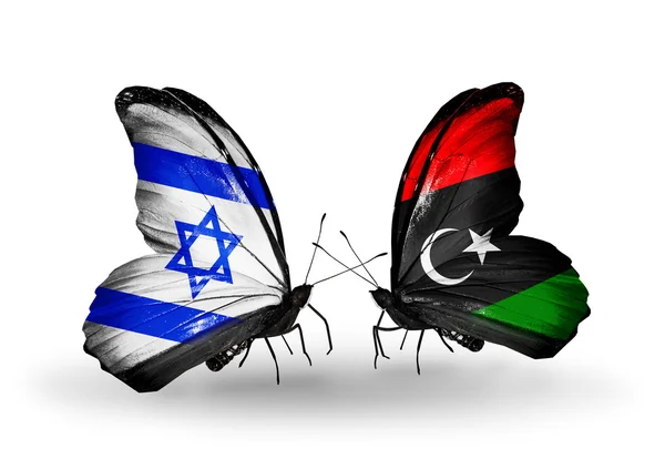 Två fjärilar med flaggor på vingarna som symbol för förbindelserna mellan israel och Libyen — Stockfoto