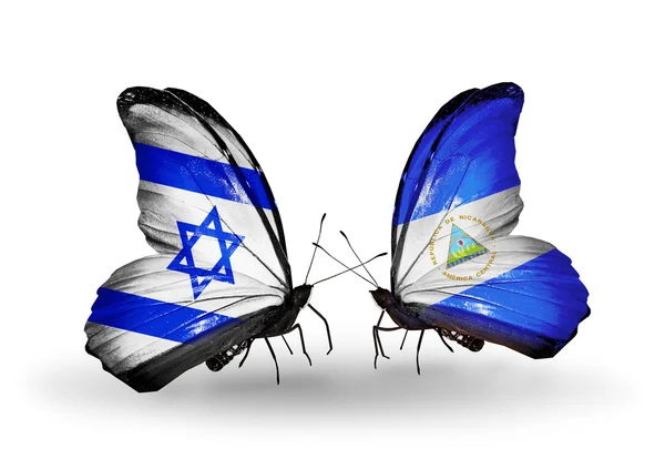 Two butterflies with flags on wings as symbol of relations Israel and Nicaragua — Stock Photo, Image