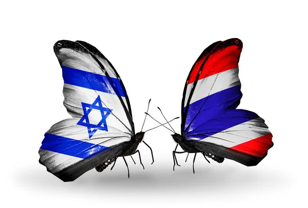 Dwa motyle z flagami na skrzydłach jako symbol stosunków Izraela i Tajlandii — Zdjęcie stockowe