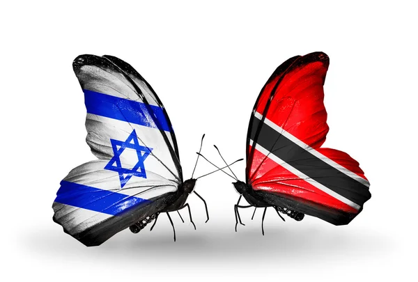 Twee vlinders met vlaggen op vleugels als symbool van de betrekkingen, Israël en trinidad en tobago — Stockfoto