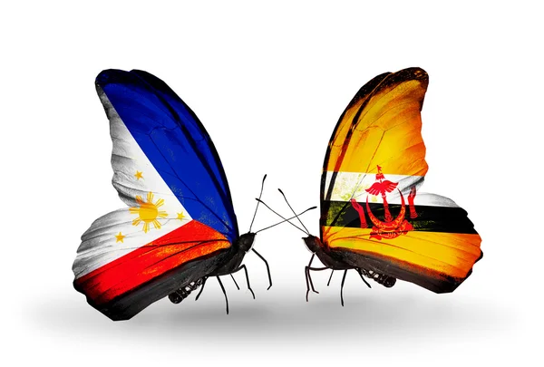 Two butterflies with flags on wings as symbol of relations Philippines and Brunei — Stock Photo, Image