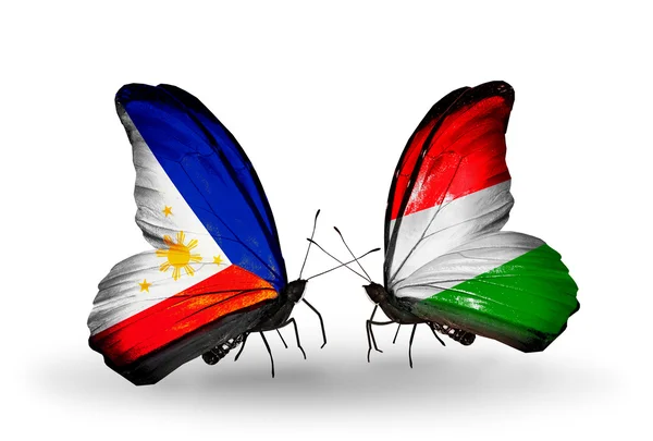 2 つの蝶の翼上のフラグとの関係の記号としてフィリピンおよびハンガリー — ストック写真