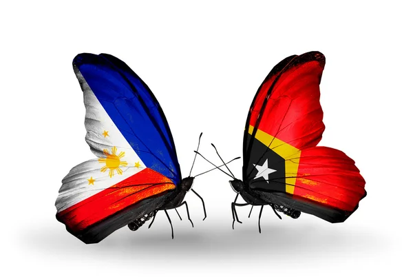 関係フィリピンのシンボルとして翼上のフラグを持つ 2 つの蝶と東ティモール — ストック写真