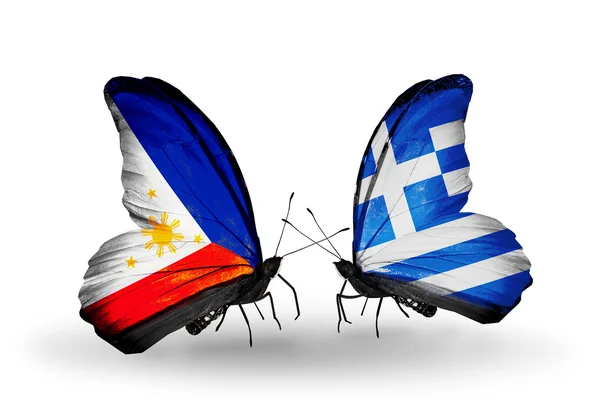 Twee vlinders met vlaggen op vleugels als symbool van de betrekkingen, Filippijnen en Griekenland — Stockfoto