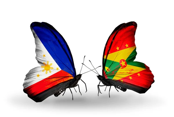 Två fjärilar med flaggor på vingarna som symbol för förbindelserna mellan Filippinerna och grenada — Stockfoto