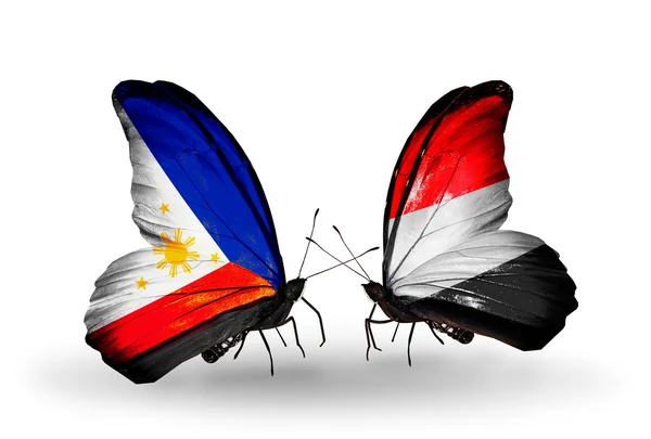 Two butterflies with flags on wings as symbol of relations Philippines and Yemen — Stock Photo, Image