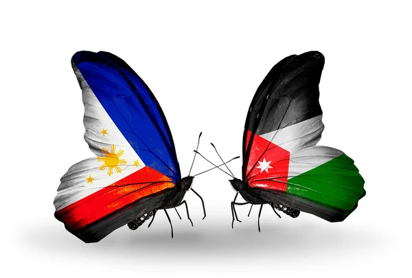 Deux papillons avec des drapeaux sur les ailes comme symbole des relations philippines et la Jordanie — Zdjęcie stockowe