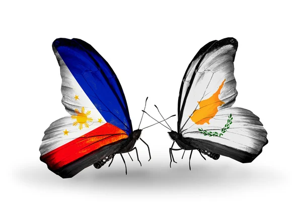 Two butterflies with flags on wings as symbol of relations Philippines and Cyprus — Stock Photo, Image