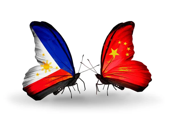 Two butterflies with flags on wings as symbol of relations Philippines and China — Stock Photo, Image