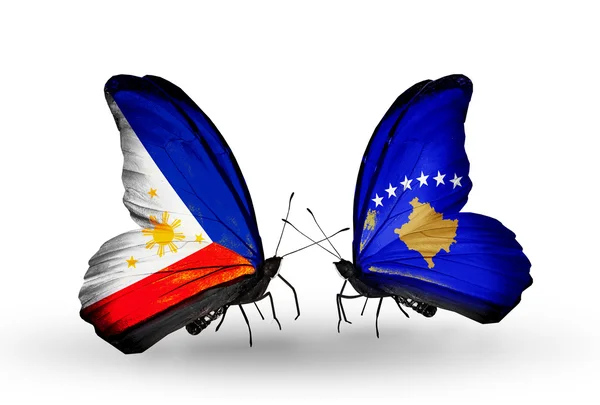 Two butterflies with flags on wings as symbol of relations Philippines and Kosovo — Stock Photo, Image