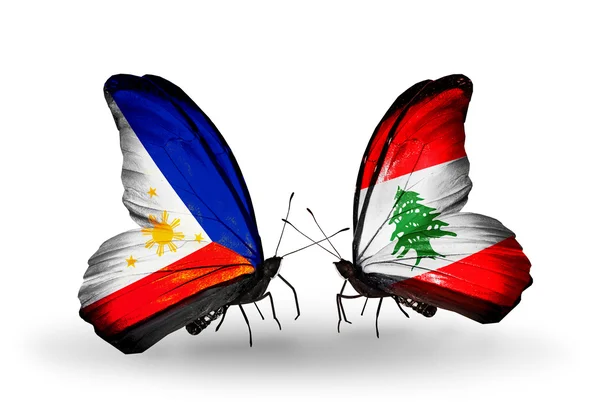 Two butterflies with flags on wings as symbol of relations Philippines and Lebanon — Stock Photo, Image