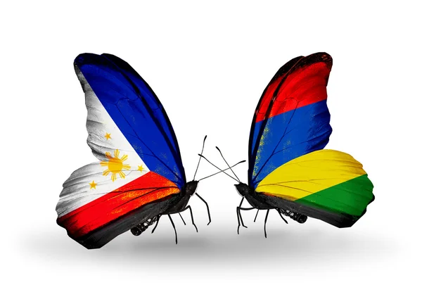 Two butterflies with flags on wings as symbol of relations Philippines and Mauritius — Stock Photo, Image