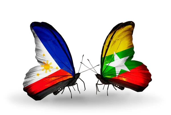 Two butterflies with flags on wings as symbol of relations Philippines and Myanmar — Stock Photo, Image
