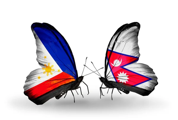 Two butterflies with flags on wings as symbol of relations Philippines and Nepal — Stock Photo, Image