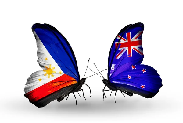 Two butterflies with flags on wings as symbol of relations Philippines and New Zealand — Stock Photo, Image