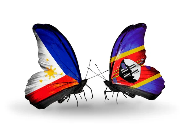 Twee vlinders met vlaggen op vleugels als symbool van de betrekkingen, Filippijnen en swaziland — Stockfoto