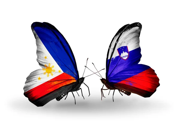 Two butterflies with flags on wings as symbol of relations Philippines and Slovenia — Stock Photo, Image