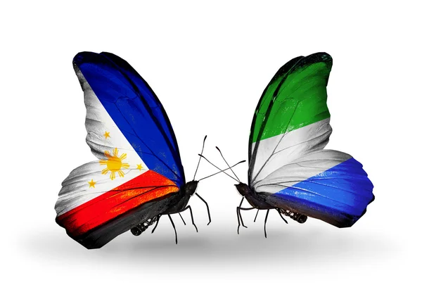 İki kanat bayrakları ile ilişkileri sembolü olarak Filipinler ve sierra leone kelebekler — Stok fotoğraf