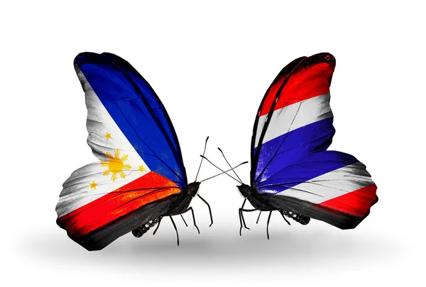 Two butterflies with flags on wings as symbol of relations Philippines and Thailand — Stock Photo, Image