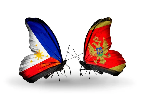 Twee vlinders met vlaggen op vleugels als symbool van de betrekkingen, Filippijnen en montenegro — Stockfoto