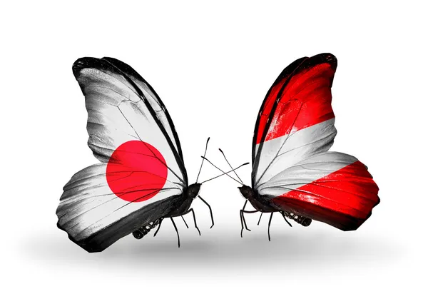 Two butterflies with flags on wings as symbol of relations Japan and Austria — Stock Photo, Image