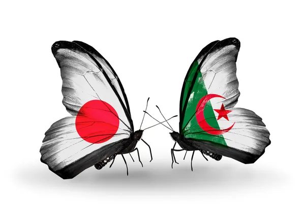 Deux papillons avec des drapeaux sur les ailes comme symbole des relations Japon et Algérie — Photo