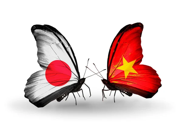 Two butterflies with flags on wings as symbol of relations Japan and Vietnam — Stock Photo, Image