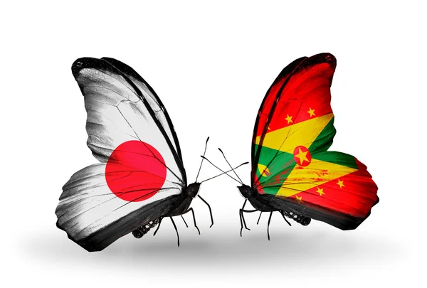 Two butterflies with flags on wings as symbol of relations Japan and Grenada — Stock Photo, Image