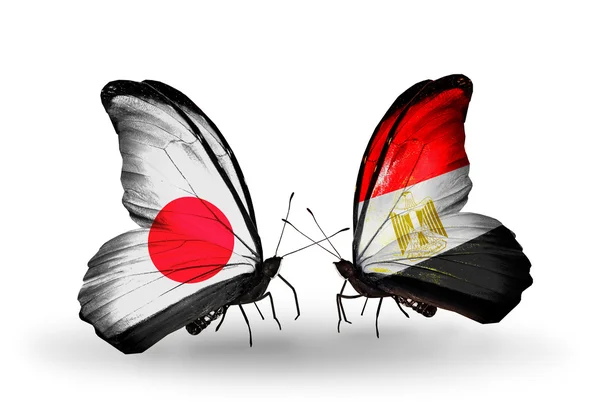 Two butterflies with flags on wings as symbol of relations Japan and Egypt — Stock Photo, Image